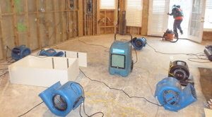 Water damage equipment in living room